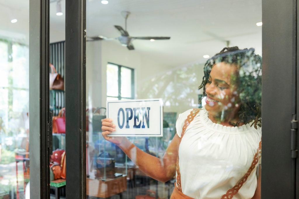 Shop assistant opening store